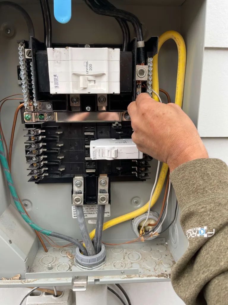 Electrician checking the electrical lines in the power box